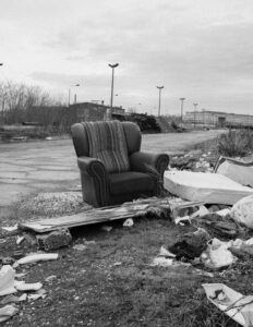 An Old Chair Ready To Be Taken To The Dump