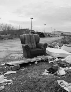 An Old Chair Ready To Be Taken To The Dump