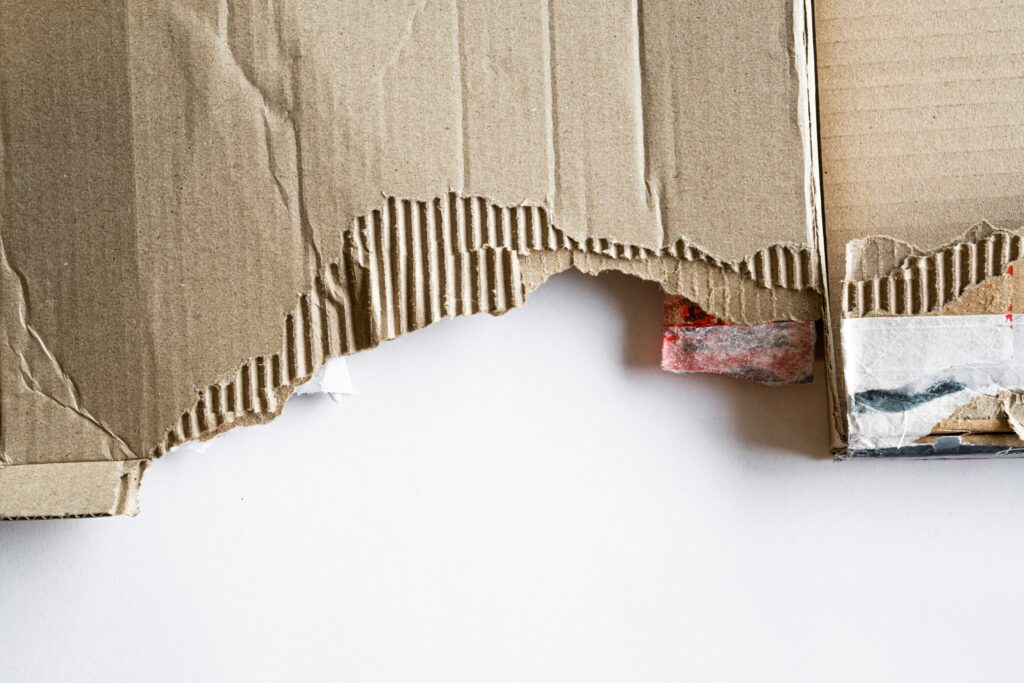 A picture of torn up, junky cardboard that needs to be disposed of properly