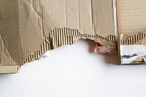 A picture of torn up, junky cardboard that needs to be disposed of properly