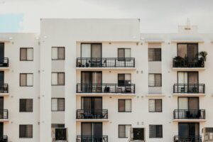 View of Florida apartments with white exterior and balconies
